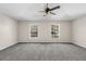 Spacious bedroom with neutral carpeting and large windows at 632 Monte Vista Way, Winter Garden, FL 34787
