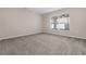 Spacious bedroom with neutral carpeting and large window at 632 Monte Vista Way, Winter Garden, FL 34787