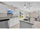 Bright kitchen features granite island, stainless steel appliances, and backyard access at 632 Monte Vista Way, Winter Garden, FL 34787