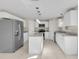 Modern kitchen with white cabinets, granite counters and island at 632 Monte Vista Way, Winter Garden, FL 34787