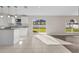 Modern kitchen with white cabinets, granite counters and island at 632 Monte Vista Way, Winter Garden, FL 34787