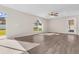 Spacious living room with wood-look floors and backyard access at 632 Monte Vista Way, Winter Garden, FL 34787