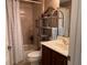 Bathroom featuring a vanity with marble countertop, and tiled shower with a shower curtain at 752 Maybank Loop, The Villages, FL 32162