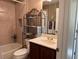Cozy bathroom featuring a vanity with marble countertop, and tiled shower at 752 Maybank Loop, The Villages, FL 32162