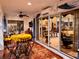 Enclosed lanai with comfortable seating, dining table, and views of the surrounding property at 752 Maybank Loop, The Villages, FL 32162
