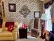 Cozy living room with decorative wall art, ambient lighting, and comfortable seating at 752 Maybank Loop, The Villages, FL 32162