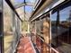 Sunroom with screen windows providing beautiful views of the yard at 752 Maybank Loop, The Villages, FL 32162