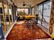 Stylish sunroom with custom rug and lots of room for entertaining at 752 Maybank Loop, The Villages, FL 32162