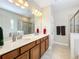 Double vanity bathroom with large mirror and separate shower at 765 Walkers Grove Ln, Winter Garden, FL 34787