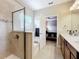 Elegant bathroom with double vanity, soaking tub, and walk-in shower at 765 Walkers Grove Ln, Winter Garden, FL 34787
