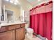 Clean bathroom with shower/tub combo, vanity, and toilet at 765 Walkers Grove Ln, Winter Garden, FL 34787