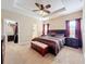 Large bedroom with king bed, walk-in closet, and ceiling fan at 765 Walkers Grove Ln, Winter Garden, FL 34787