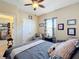 Bedroom with a queen bed and comfortable seating at 765 Walkers Grove Ln, Winter Garden, FL 34787