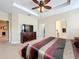 Spacious bedroom with king-size bed and large dresser at 765 Walkers Grove Ln, Winter Garden, FL 34787