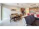 Dining area with wooden table and view into the living room at 765 Walkers Grove Ln, Winter Garden, FL 34787