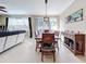 Open concept dining area with wood table and access to backyard at 765 Walkers Grove Ln, Winter Garden, FL 34787