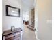 Bright and airy entryway with stairs to the second floor and views to the living area at 765 Walkers Grove Ln, Winter Garden, FL 34787