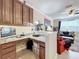 Home office with granite countertop, built in desk and cabinets at 765 Walkers Grove Ln, Winter Garden, FL 34787