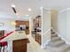 Open concept kitchen with granite countertops and stainless steel appliances at 765 Walkers Grove Ln, Winter Garden, FL 34787
