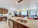 Modern kitchen with stainless steel appliances and granite countertops at 765 Walkers Grove Ln, Winter Garden, FL 34787