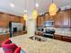 Modern kitchen with stainless steel appliances and granite countertops at 765 Walkers Grove Ln, Winter Garden, FL 34787