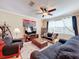 Bright living room with ample seating and entertainment center at 765 Walkers Grove Ln, Winter Garden, FL 34787