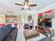 Comfortable living room with sectional sofa and ceiling fan at 765 Walkers Grove Ln, Winter Garden, FL 34787