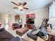 Relaxing living room with comfy seating and a large TV at 765 Walkers Grove Ln, Winter Garden, FL 34787