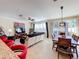 Open living and dining area with hardwood floors and lots of natural light at 765 Walkers Grove Ln, Winter Garden, FL 34787