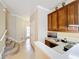Home office with built-in desk and cabinets at 765 Walkers Grove Ln, Winter Garden, FL 34787