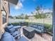 Private patio with seating area, grill, and lush landscaping at 765 Walkers Grove Ln, Winter Garden, FL 34787