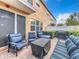Relaxing patio with seating area, grill, and lush landscaping at 765 Walkers Grove Ln, Winter Garden, FL 34787