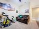 Recreation room with exercise bike and seating area at 765 Walkers Grove Ln, Winter Garden, FL 34787