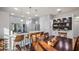 Open concept dining area and kitchen with wood table and island at 8801 Village Green Blvd, Clermont, FL 34711