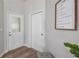 Entryway with hardwood floors, a coat closet, and inspirational wall art at 8801 Village Green Blvd, Clermont, FL 34711