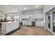 Bright kitchen with white cabinets, stainless steel appliances, and an island at 8801 Village Green Blvd, Clermont, FL 34711