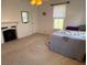 Bright bedroom with fireplace, carpet, and large window at 110 N Volusia Ave, Pierson, FL 32180