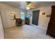 Bedroom with window, ceiling fan, and built-in shelving at 110 N Volusia Ave, Pierson, FL 32180