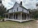 Two story home with wrap around porch, side view at 110 N Volusia Ave, Pierson, FL 32180