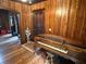 Antique piano in an interior room with wood walls at 110 N Volusia Ave, Pierson, FL 32180