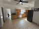 Classic kitchen features wood cabinets, tile floors, and stainless steel appliances at 110 N Volusia Ave, Pierson, FL 32180