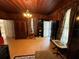 Living room with hardwood floors and wood walls at 110 N Volusia Ave, Pierson, FL 32180