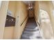 Clean condo building interior stairwell with mailboxes at 1112 W Main St # E7, Leesburg, FL 34748