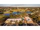 Community overview, featuring golf course and lake at 1121 Paradise Dr, Lady Lake, FL 32159