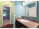 Bathroom with wood vanity and mirror at 1121 Paradise Dr, Lady Lake, FL 32159