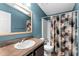 Bathroom with wood vanity and shower/tub at 1121 Paradise Dr, Lady Lake, FL 32159
