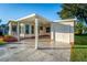 Covered carport with concrete driveway at 1121 Paradise Dr, Lady Lake, FL 32159