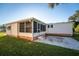 Single story home with screened porch and patio at 1121 Paradise Dr, Lady Lake, FL 32159