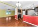 Open kitchen with breakfast nook and wood flooring at 1121 Paradise Dr, Lady Lake, FL 32159
