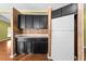 Kitchen features dark wood cabinets, granite countertops, and white appliances at 1121 Paradise Dr, Lady Lake, FL 32159
